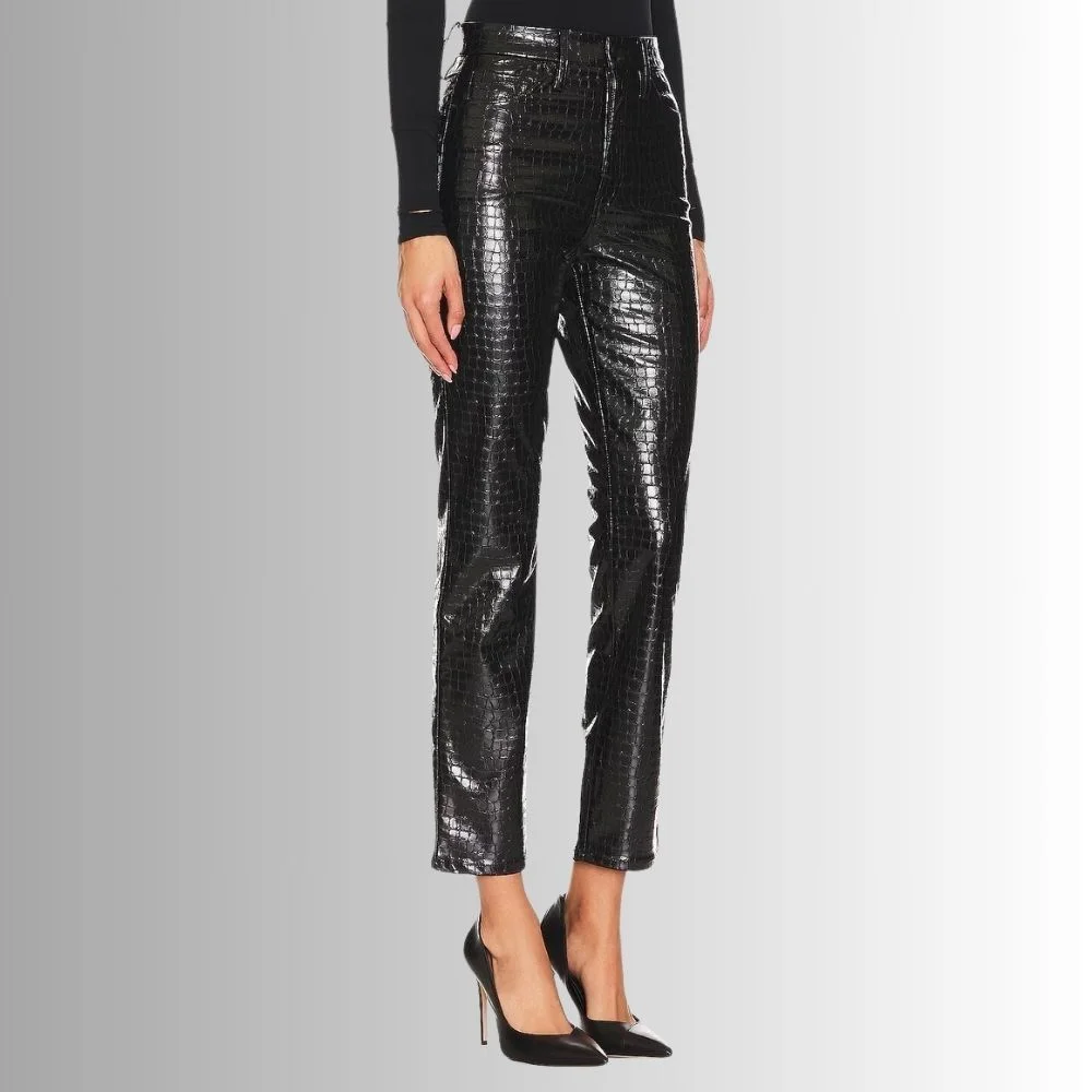 Trendy black leather pants with a crocodile pattern, worn by a female model in a side view.